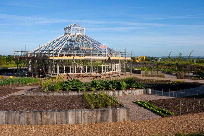 The octagonal glasshouse frame is built