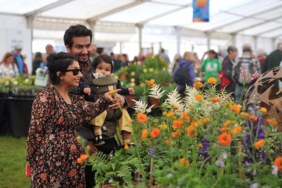 A family look at flowers in the Floral Marquee