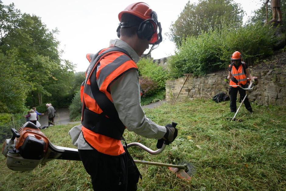 A hard hat, ear defenders and face visor protect from noise and the objects flicked up by a strimmer.