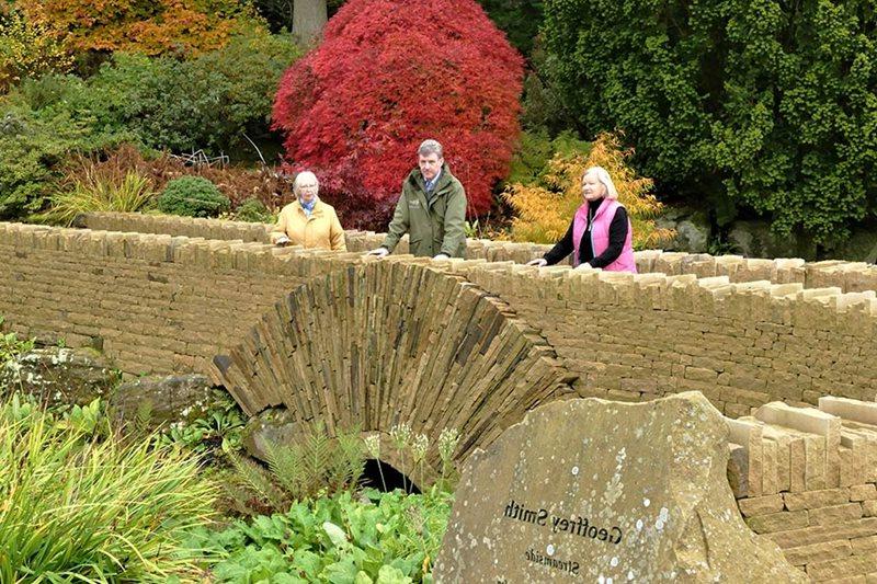 Members of Friends of Harlow Carr on Friendship Bridge with Curator Paul Cook