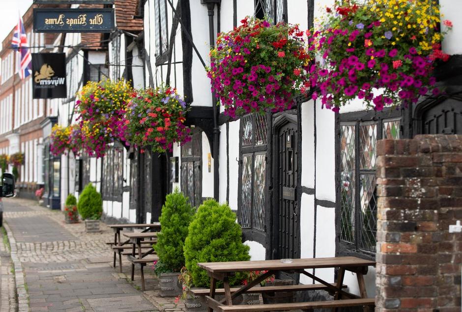 Traditional summer hanging baskets brightening up a street in Amersham