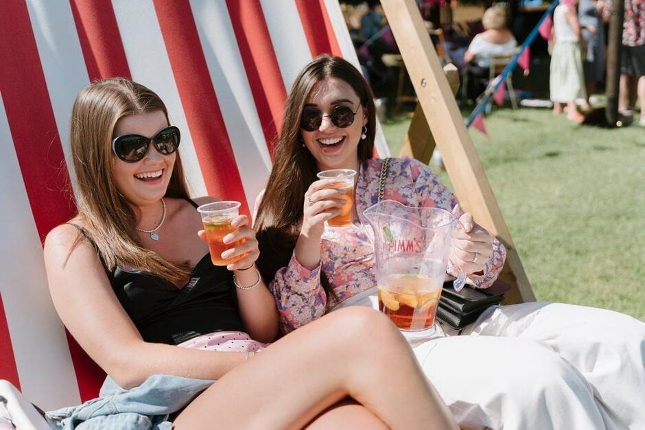 Show visitors have a drink in the sunshine