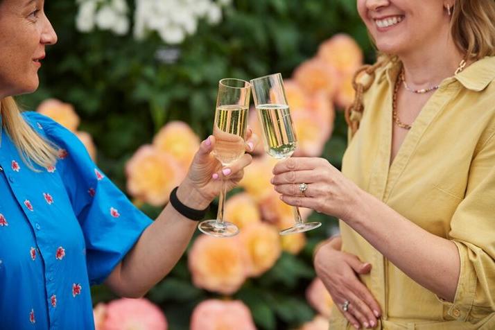 Friends enjoy champagne at RHS Chelsea Flower Show