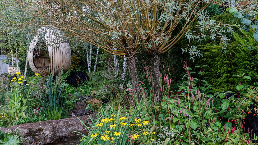 A sense of the Mendip Hills has been created here, using plants at home in the country combined with their ornamental relatives and pathways of Mendip stone meandering throughout