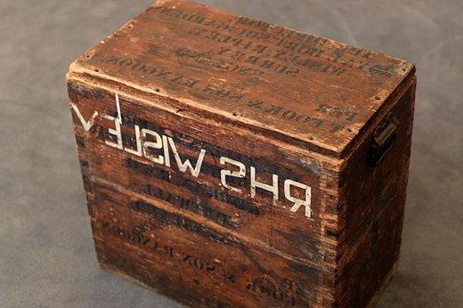 Wooden box used for transporting plant hunting specimens. The box is stamped with the address of 'The Director. Royal Horticultural Soc. Garden, Wisley’. It also carries the mark of T.Cook & Son Rangoon and the address of 'J C Williams at Caerhays Castle, Cornwall'.